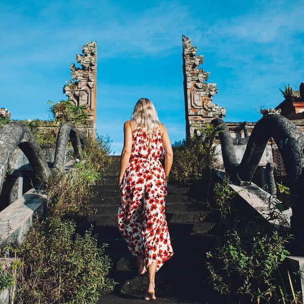 Young blonde caucasian woman traveling in the mountains